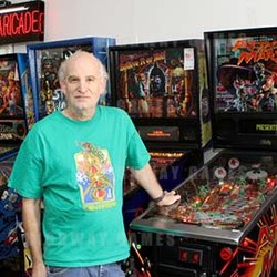 Gene Lewin stands in the showroom of Vintage Arcade Superstore. Picture: Raul Roa / Glendale News-Press
